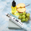 Modern vape mod with vape oil and fruits arranged on a blue background, representing vaping products and flavor concepts