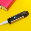 Electronic cigarette for vaping connected to charge energy via USB cable